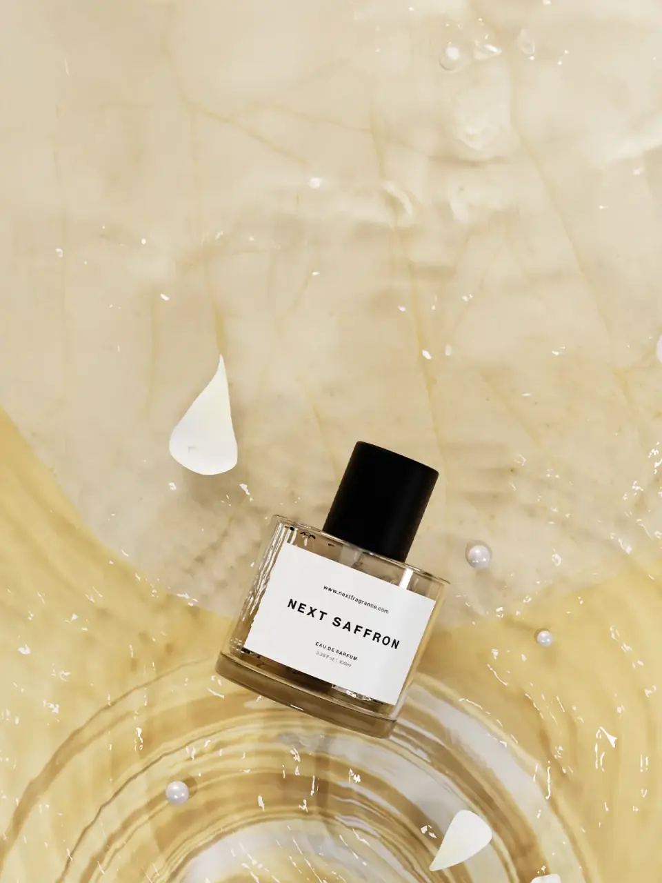 Next Saffron eau de parfum 100ml resting in saffron-tinted water